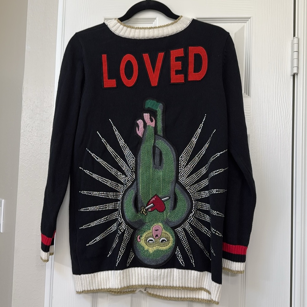 *Believed to be Gucci Cardigan. Please see additional information.